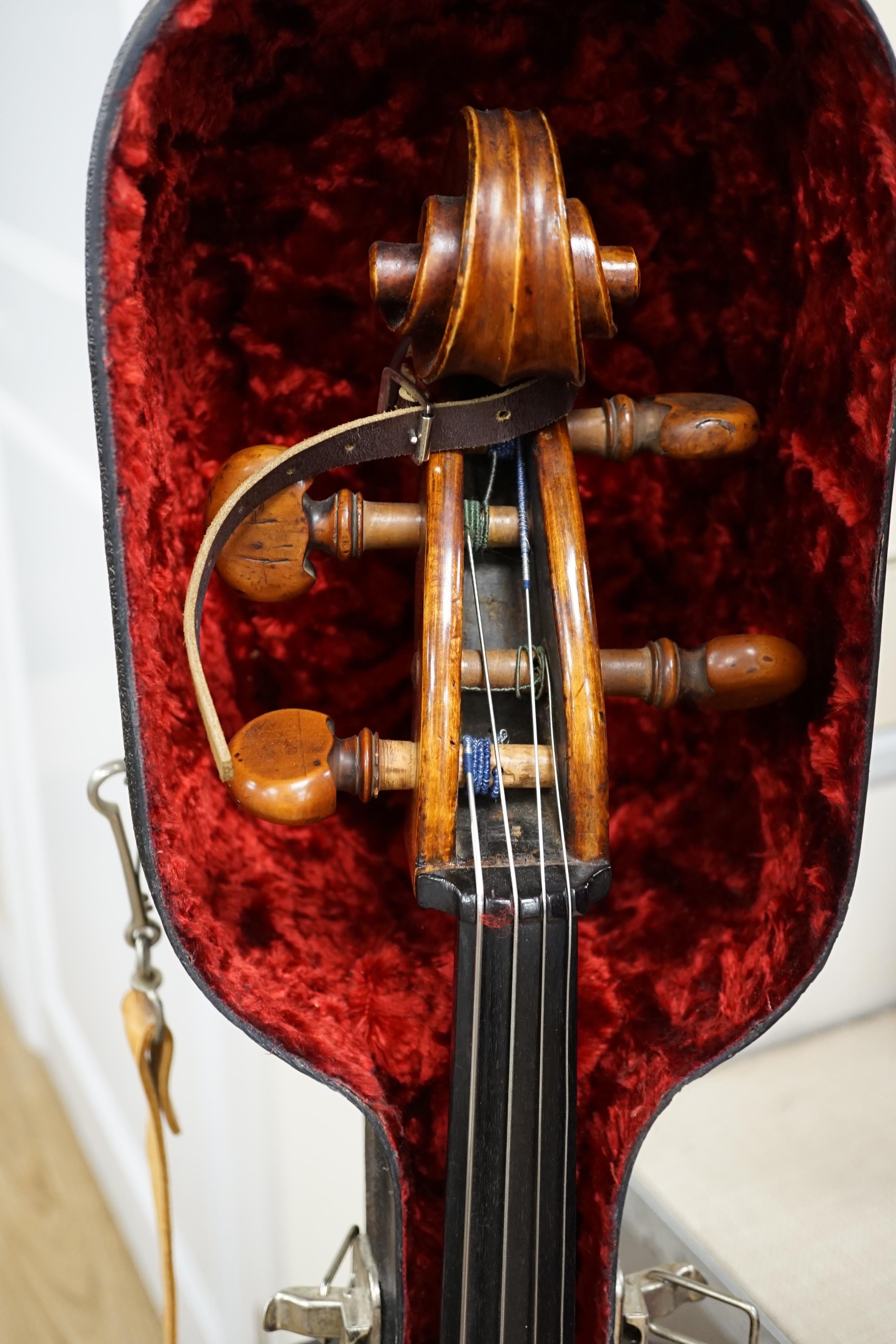 A cased early 20th century ‘cello, length of body 75.5cm, with two spare bridges, and spare strings